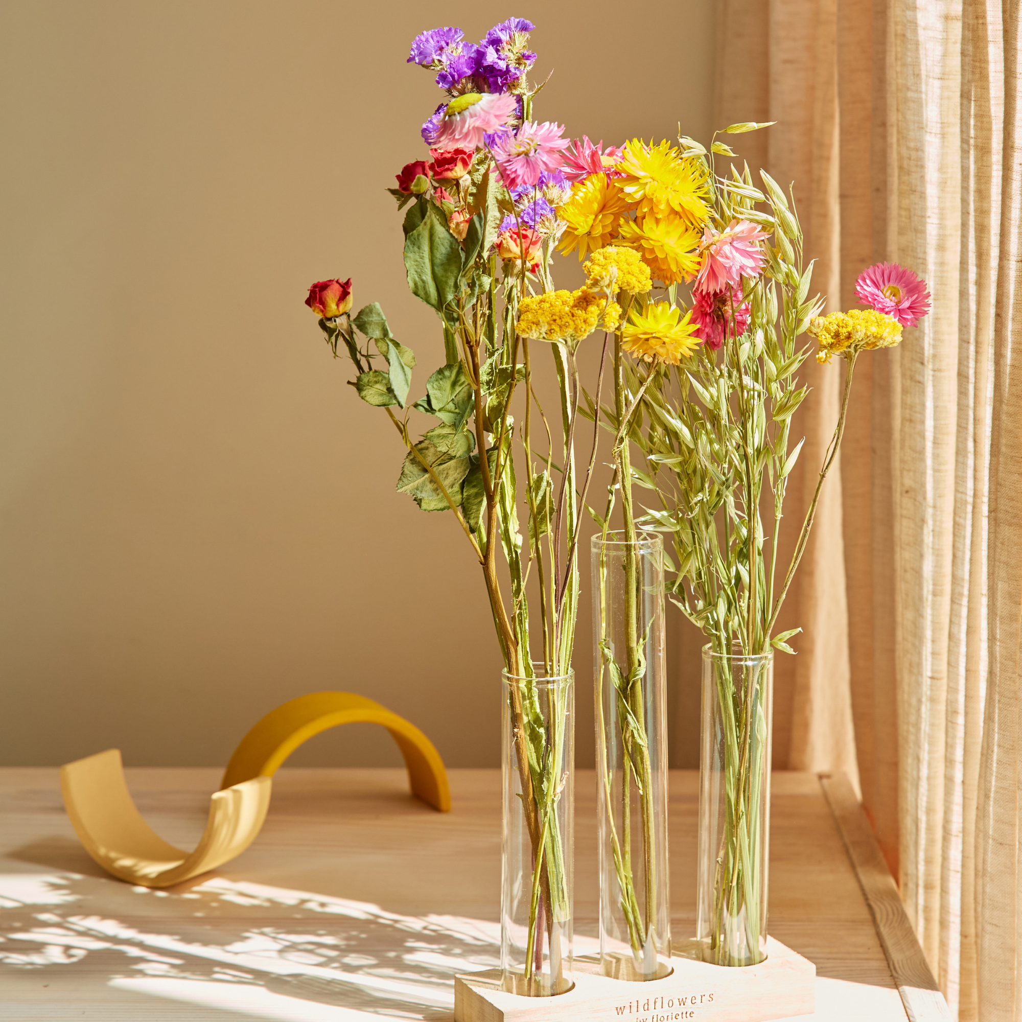 Dried flowers arranged in glass vases