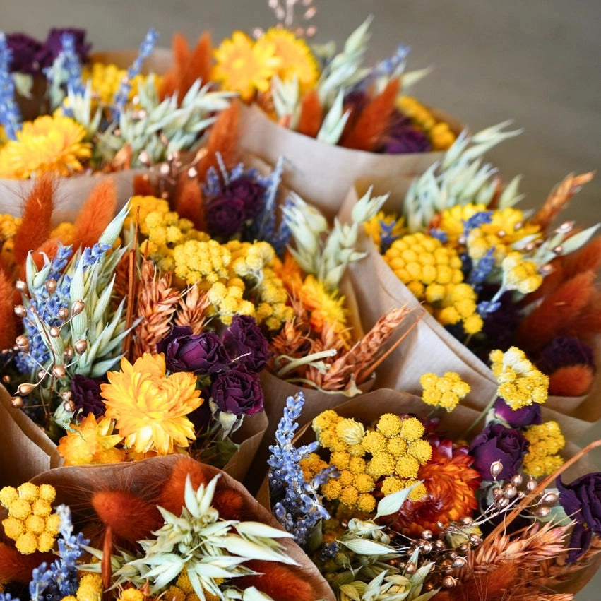 Autumn dried bouquets in kraft paper wraps